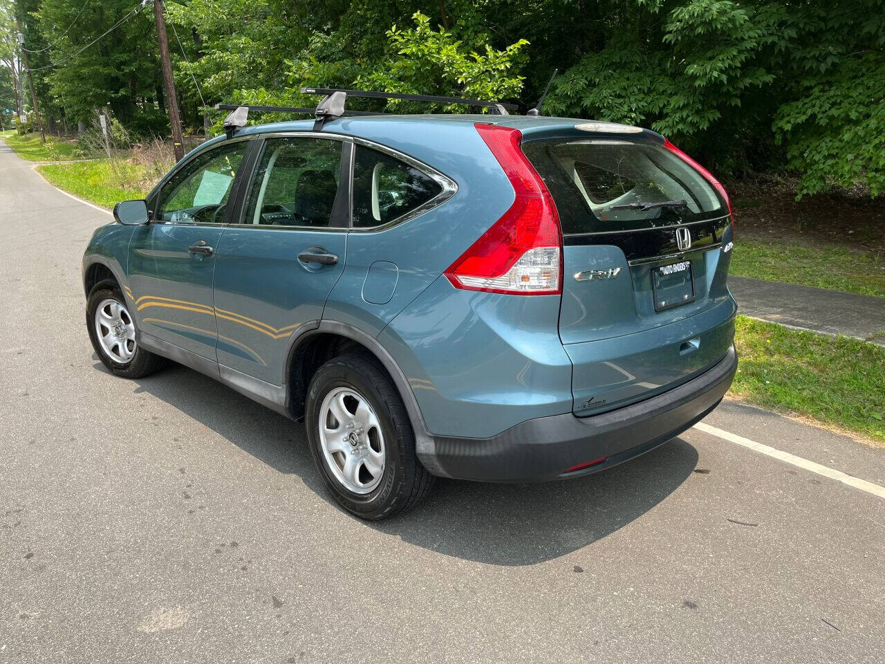 Preowned 2014 HONDA CR-V LX AWD 4dr SUV for sale by The Auto Finders Car Dealership of Durham in Durham, NC