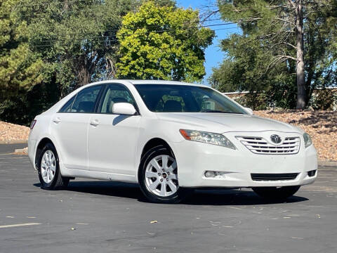 2009 Toyota Camry for sale at Used Cars and Trucks For Less in Millcreek UT