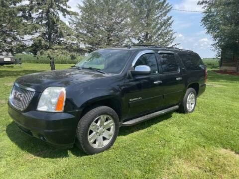 2011 GMC Yukon XL for sale at COUNTRYSIDE AUTO INC in Austin MN