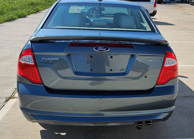 2011 Ford Fusion for sale at CAR MARKET AUTO GROUP in Sugar Land, TX