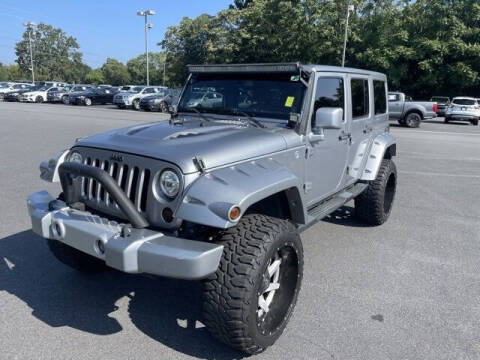 2013 Jeep Wrangler Unlimited for sale at BILLY HOWELL FORD LINCOLN in Cumming GA