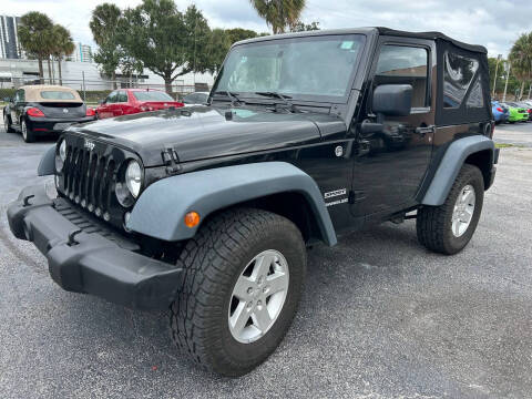 2015 Jeep Wrangler for sale at MITCHELL MOTOR CARS in Pompano Beach FL