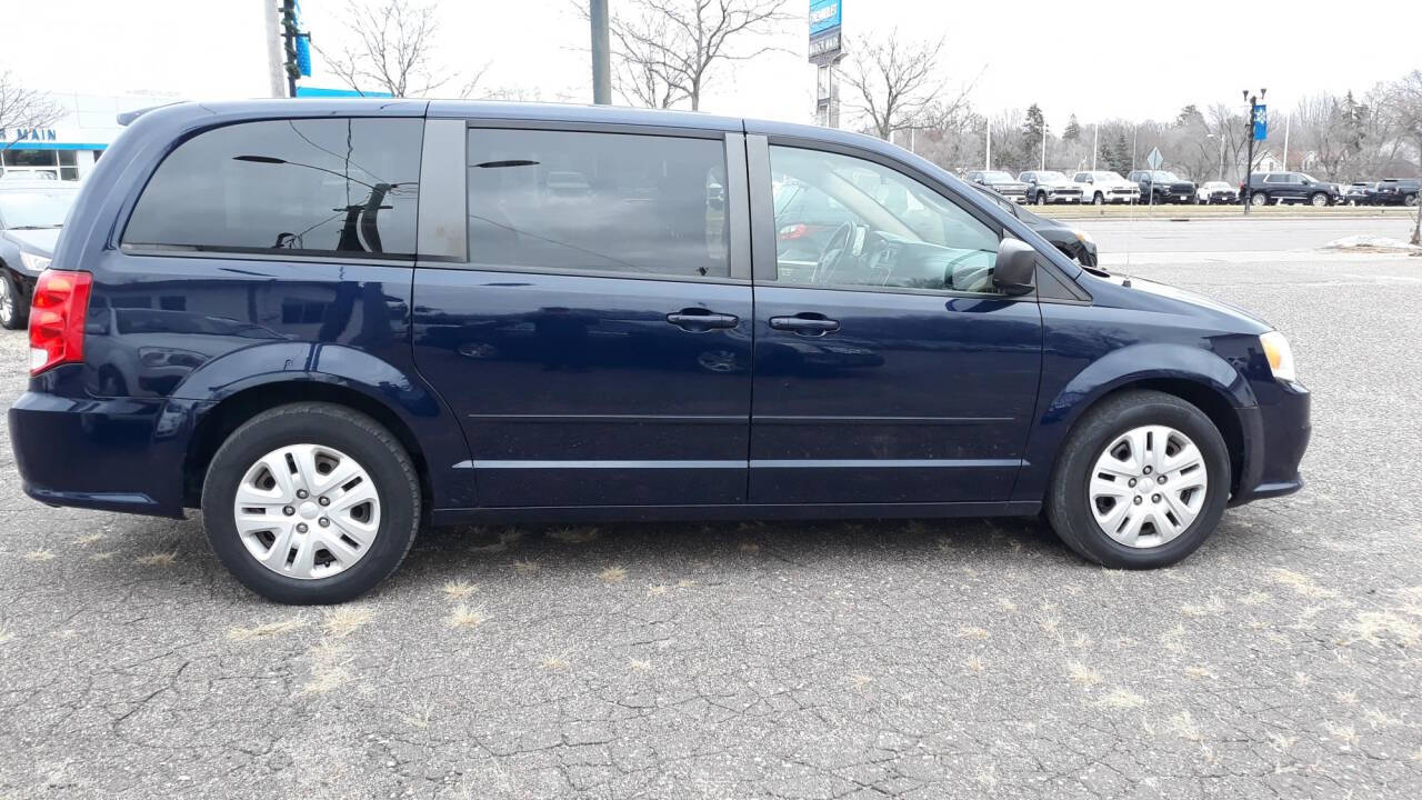 2014 Dodge Grand Caravan for sale at CHRISTIAN AUTO SALES in Anoka, MN