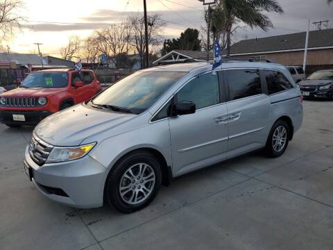 2012 Honda Odyssey for sale at E and M Auto Sales in Bloomington CA