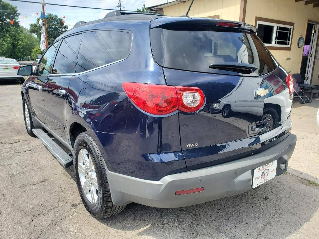 2012 Chevrolet Traverse for sale at DAGO'S AUTO SALES LLC in Dalton, GA