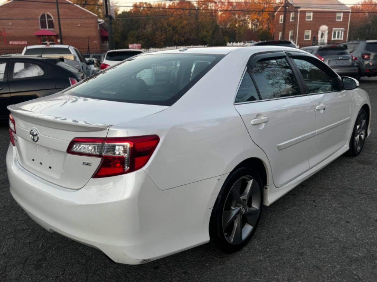 2014 Toyota Camry for sale at Walkem Autos in District Heights, MD