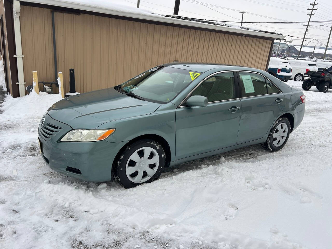 2009 Toyota Camry for sale at BNM AUTO GROUP in GIRARD, OH