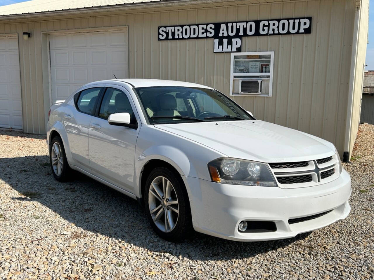 2014 Dodge Avenger for sale at STRODES AUTO GROUP LLP in Malta, OH