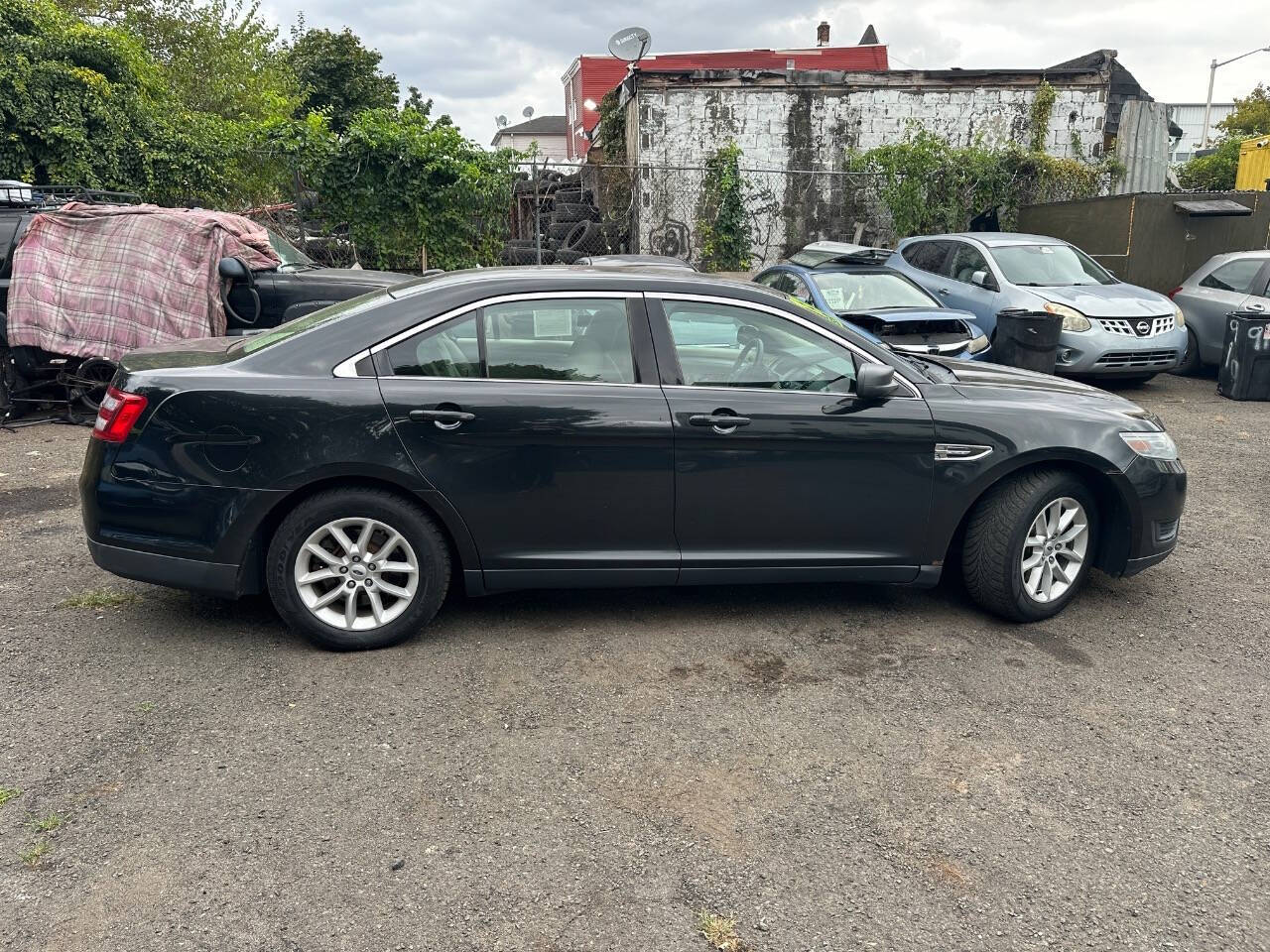 2013 Ford Taurus for sale at 77 Auto Mall in Newark, NJ