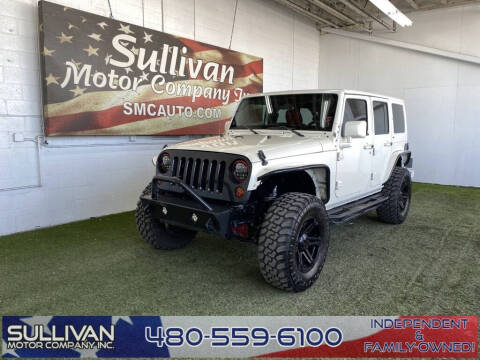 2013 Jeep Wrangler Unlimited for sale at SULLIVAN MOTOR COMPANY INC. in Mesa AZ