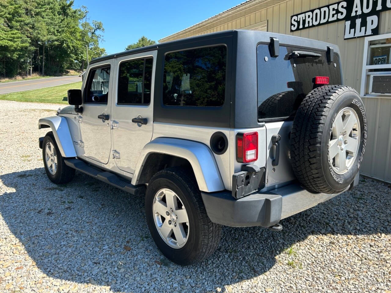 2012 Jeep Wrangler Unlimited for sale at STRODES AUTO GROUP LLP in Malta, OH