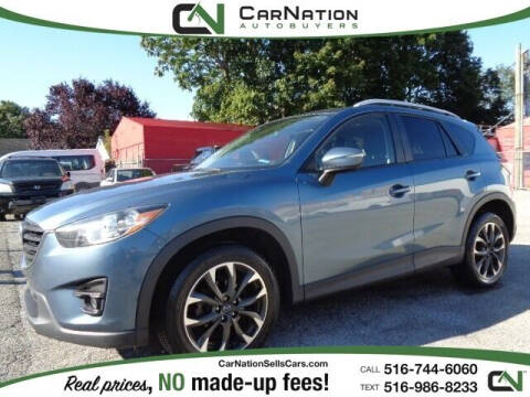 2016 Mazda CX-5 for sale at CarNation AUTOBUYERS Inc. in Rockville Centre NY