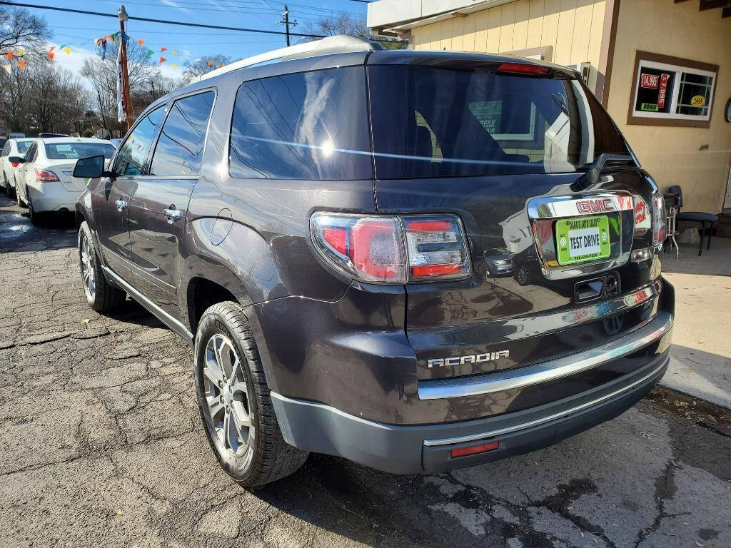 2014 GMC Acadia for sale at DAGO'S AUTO SALES LLC in Dalton, GA