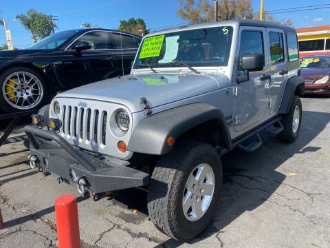 2012 Jeep Wrangler Unlimited for sale at Crown Auto Inc in South Gate CA