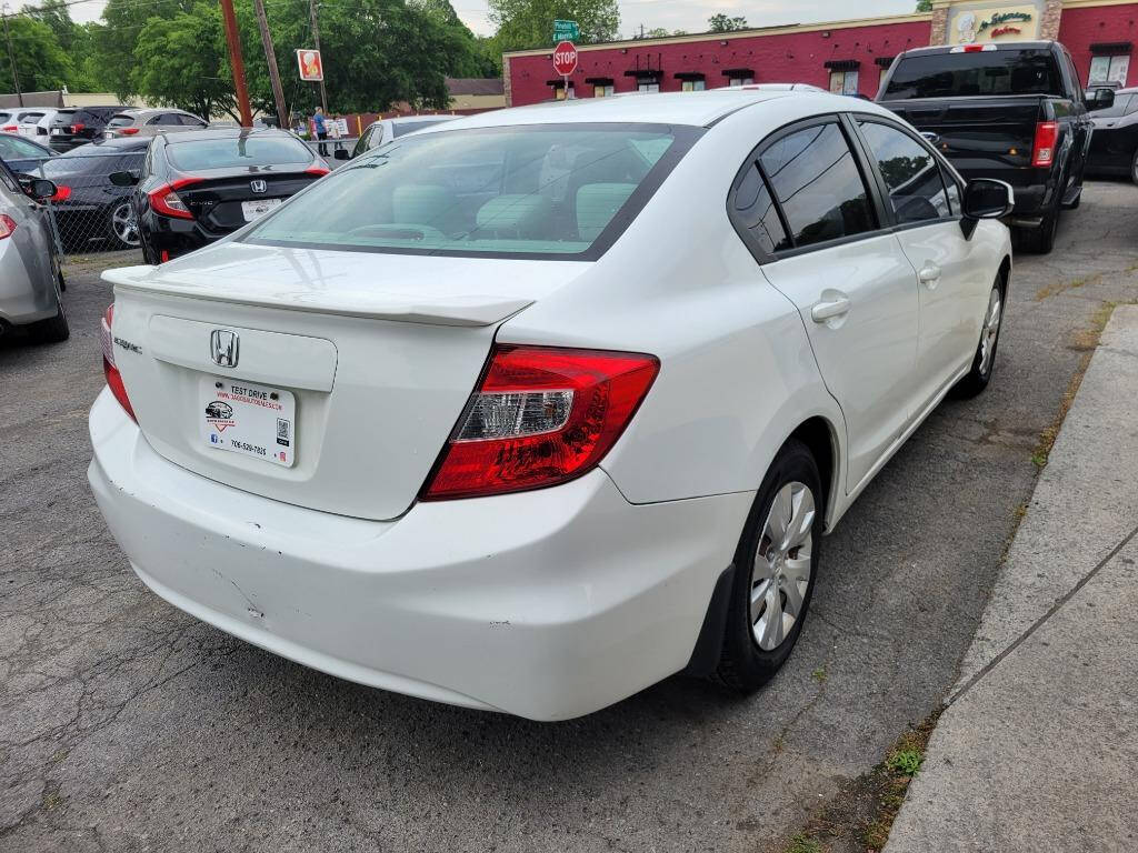 2012 Honda Civic for sale at DAGO'S AUTO SALES LLC in Dalton, GA