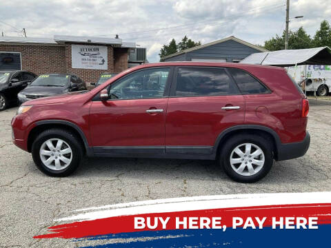 2011 Kia Sorento for sale at Autocom, LLC in Clayton NC