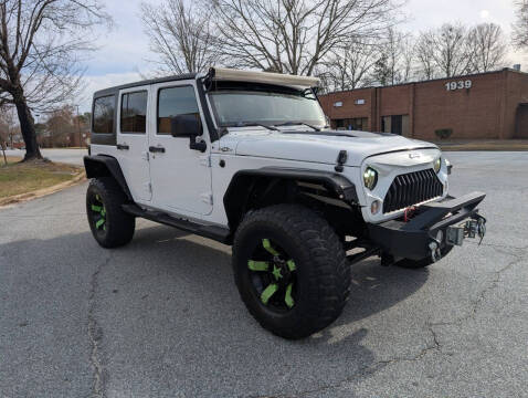 2014 Jeep Wrangler Unlimited for sale at United Luxury Motors in Stone Mountain GA