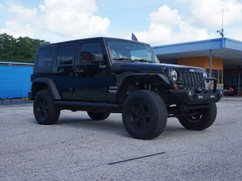 2010 Jeep Wrangler Unlimited for sale at Sunny Florida Cars in Bradenton FL
