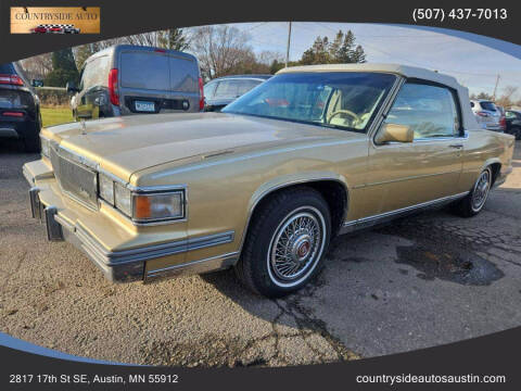 1986 Cadillac DeVille for sale at COUNTRYSIDE AUTO INC in Austin MN