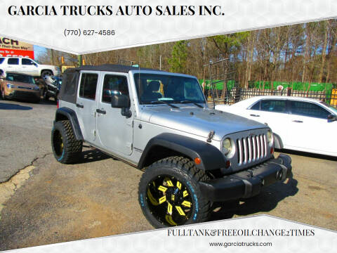 2011 Jeep Wrangler Unlimited for sale at Garcia Trucks Auto Sales Inc. in Austell GA