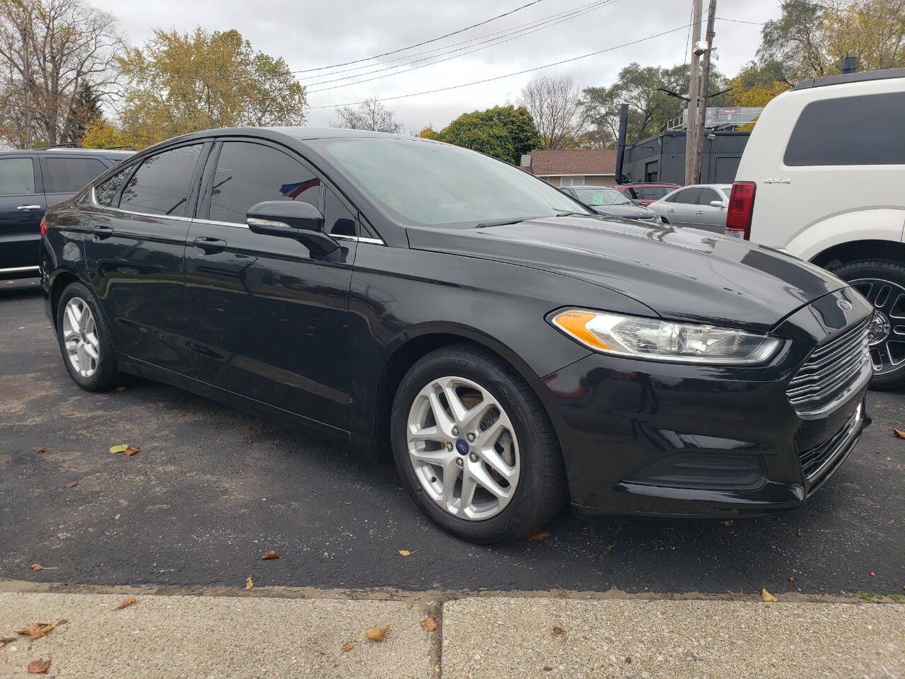 2014 Ford Fusion for sale at Auto Shop in Wyoming, MI