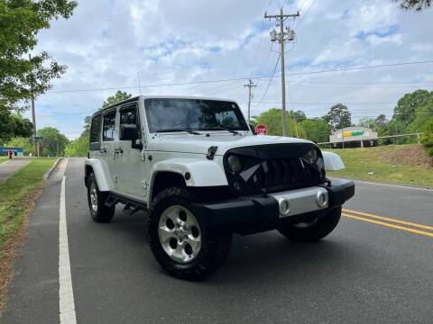 2015 Jeep Wrangler Unlimited for sale at THE AUTO FINDERS in Durham NC