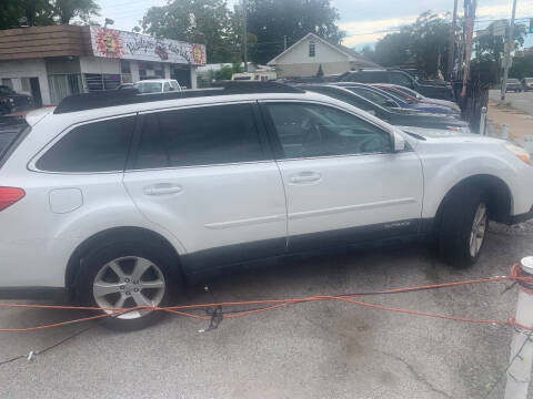 2013 Subaru Outback for sale at HIDALGOS AUTO SALES in Omaha NE