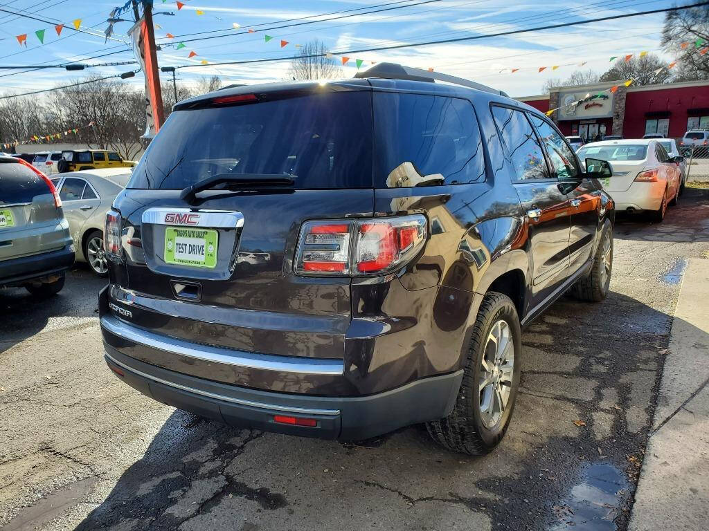 2014 GMC Acadia for sale at DAGO'S AUTO SALES LLC in Dalton, GA