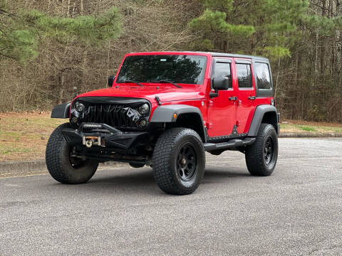 2011 Jeep Wrangler Unlimited for sale at H and S Auto Group in Canton GA