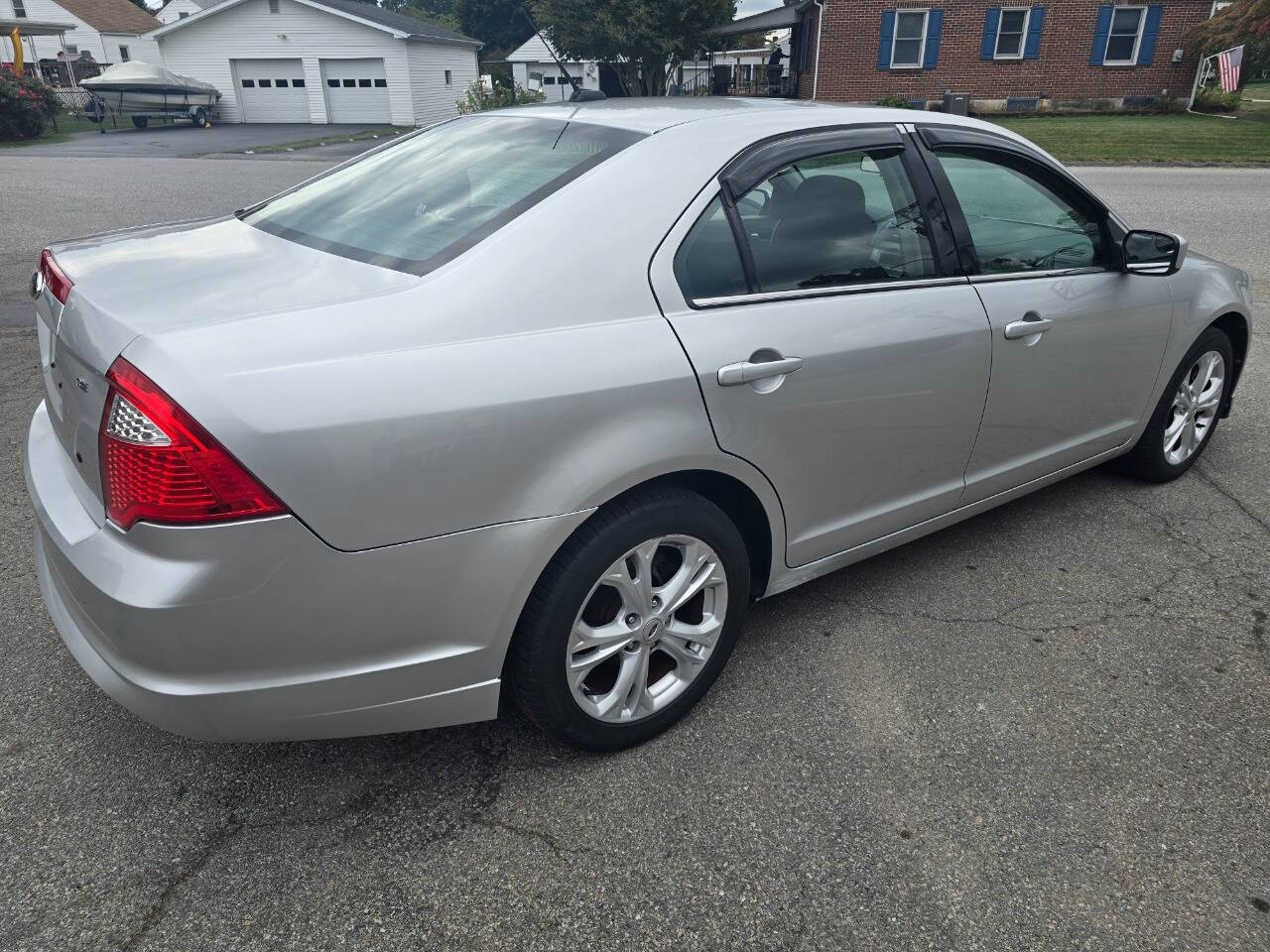 2012 Ford Fusion for sale at QUEENSGATE AUTO SALES in York, PA