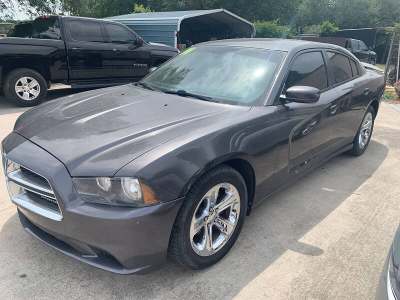 2014 Dodge Charger for sale at Memo's Auto Sales in Houston TX