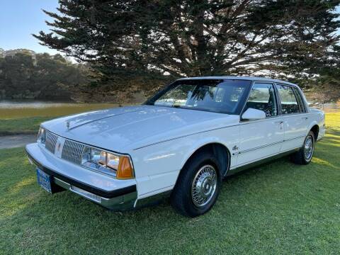 1985 Oldsmobile Ninety-Eight for sale at Dodi Auto Sales in Monterey CA