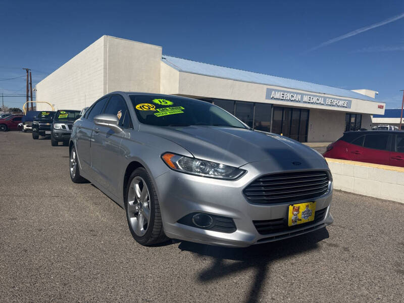 2015 Ford Fusion for sale at Miracle Motor Cars Inc. in Victorville CA