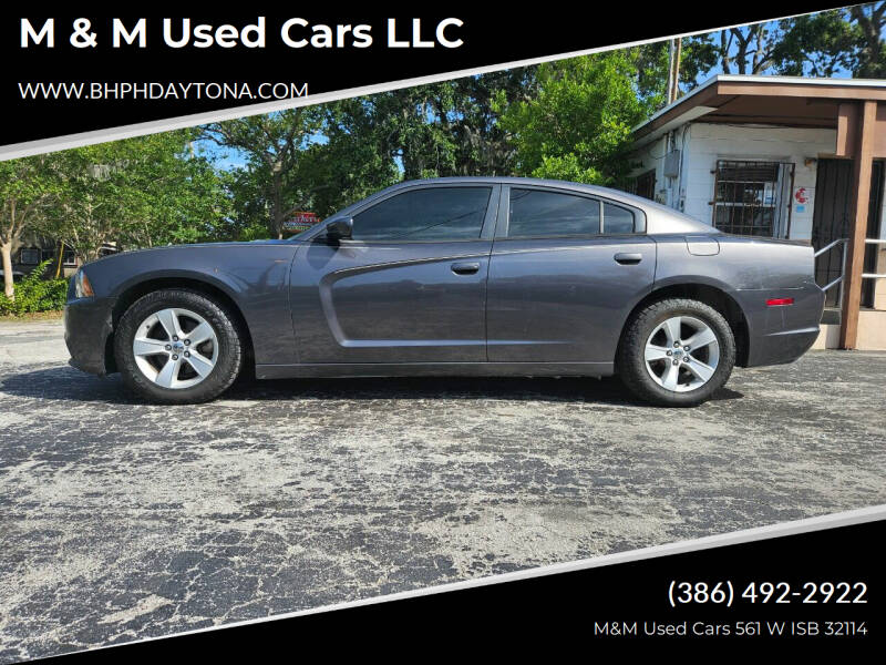 2014 Dodge Charger for sale at M & M Used Cars LLC in Daytona Beach FL