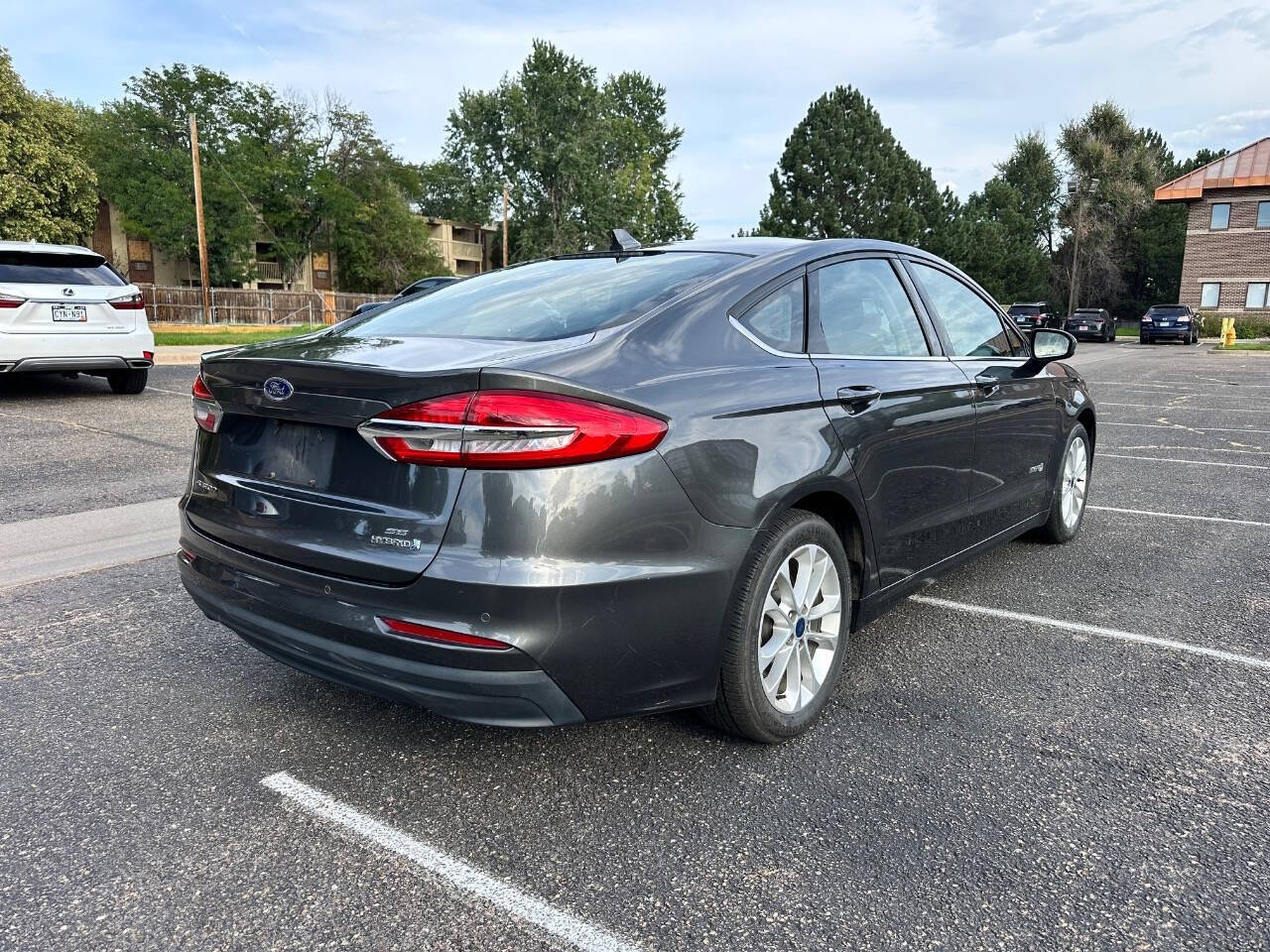 2019 Ford Fusion Hybrid for sale at AMZ Autos, LLC in Denver, CO