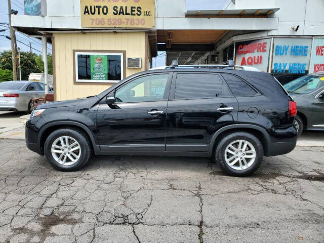 2014 Kia Sorento for sale at DAGO'S AUTO SALES LLC in Dalton, GA