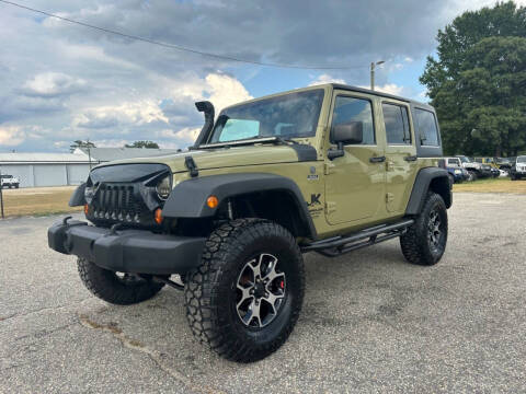 2013 Jeep Wrangler Unlimited for sale at Carworx LLC in Dunn NC