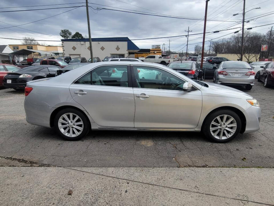 2012 Toyota Camry for sale at DAGO'S AUTO SALES LLC in Dalton, GA