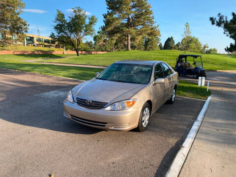 2002 Toyota Camry for sale at QUEST MOTORS in Englewood CO