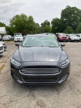 2016 Ford Fusion for sale at Autocom, LLC in Clayton NC