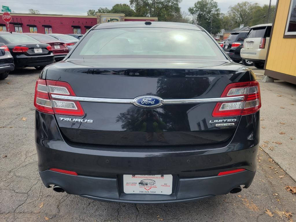 2013 Ford Taurus for sale at DAGO'S AUTO SALES LLC in Dalton, GA