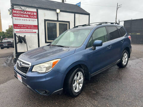 2014 Subaru Forester for sale at McManus Motors in Wheat Ridge CO