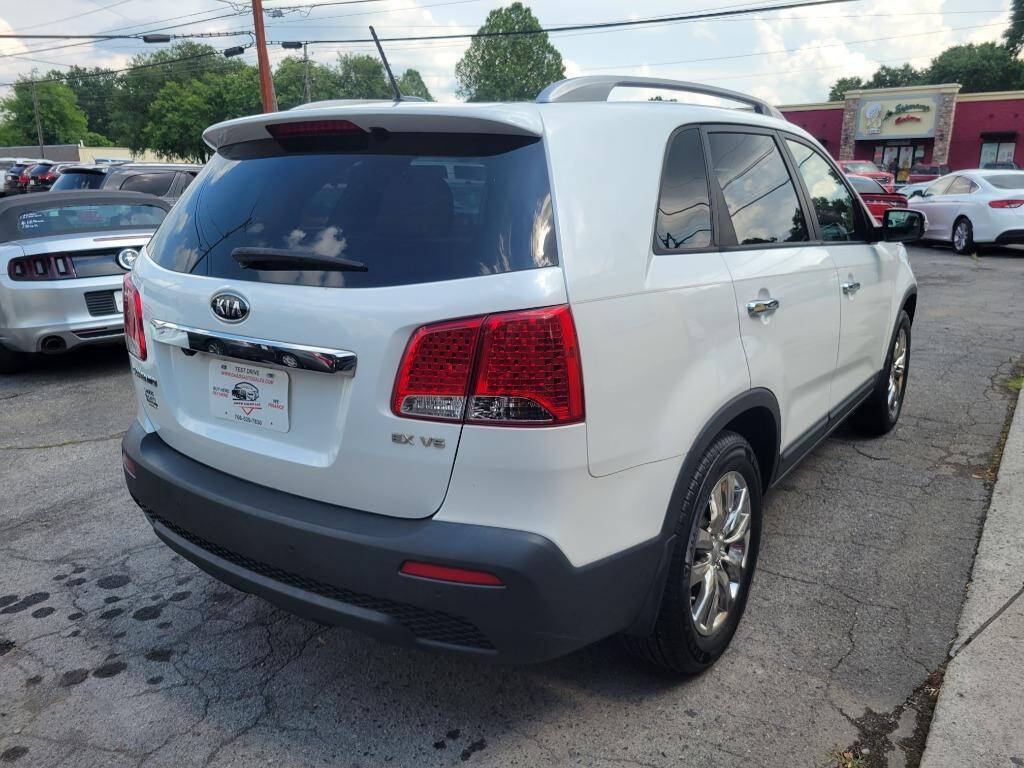 2011 Kia Sorento for sale at DAGO'S AUTO SALES LLC in Dalton, GA