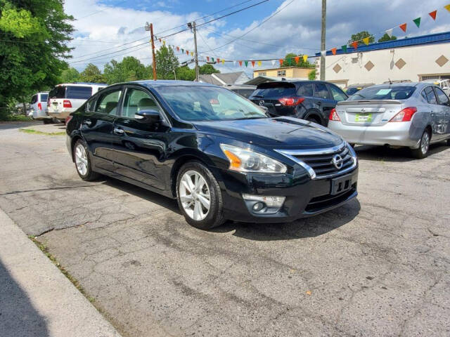 2015 Nissan Altima for sale at DAGO'S AUTO SALES LLC in Dalton, GA