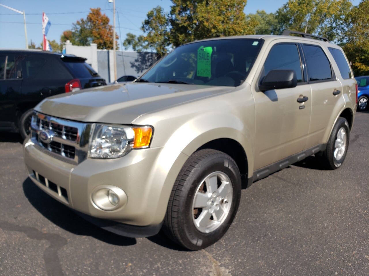 2011 Ford Escape for sale at Auto Shop in Wyoming, MI