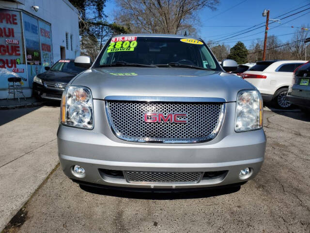 2011 GMC Yukon XL for sale at DAGO'S AUTO SALES LLC in Dalton, GA