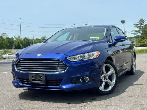 2013 Ford Fusion Hybrid for sale at MAGIC AUTO SALES in Little Ferry NJ