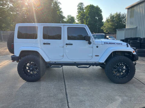 2013 Jeep Wrangler Unlimited for sale at ALLEN JONES USED CARS INC in Steens MS