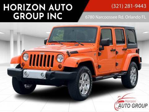 2012 Jeep Wrangler Unlimited for sale at HORIZON AUTO GROUP INC in Orlando FL