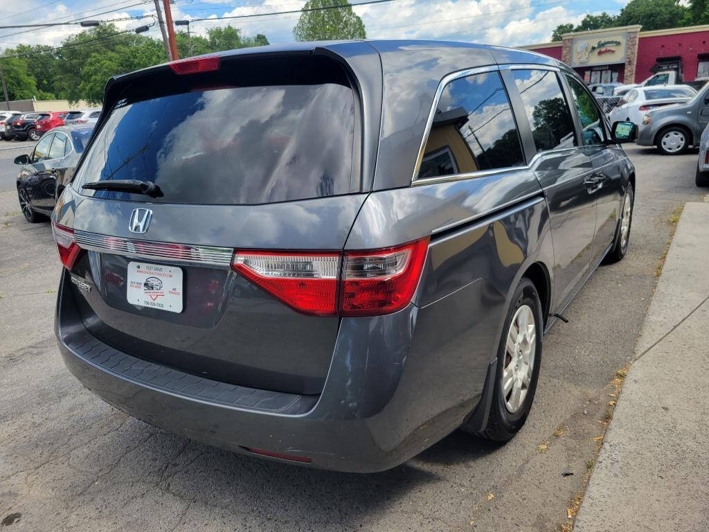 2012 Honda Odyssey for sale at DAGO'S AUTO SALES LLC in Dalton, GA